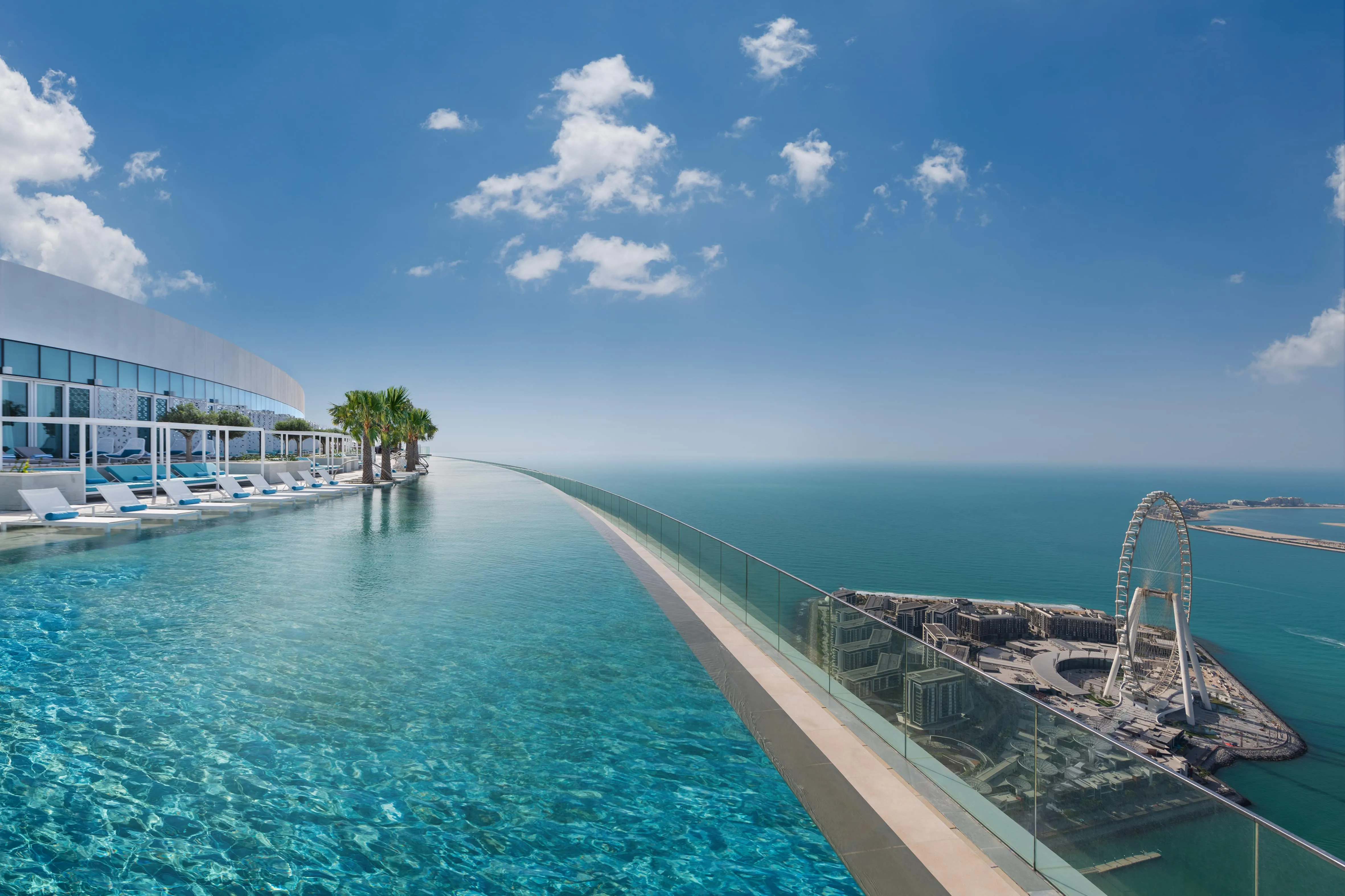 Infinity pool on the 77th floor of Address Beach Resort with Dubai skyline at sunset
